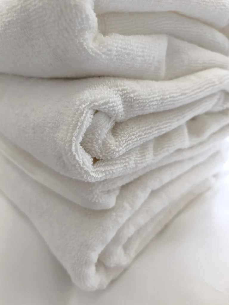 private label white hotel towels stacked