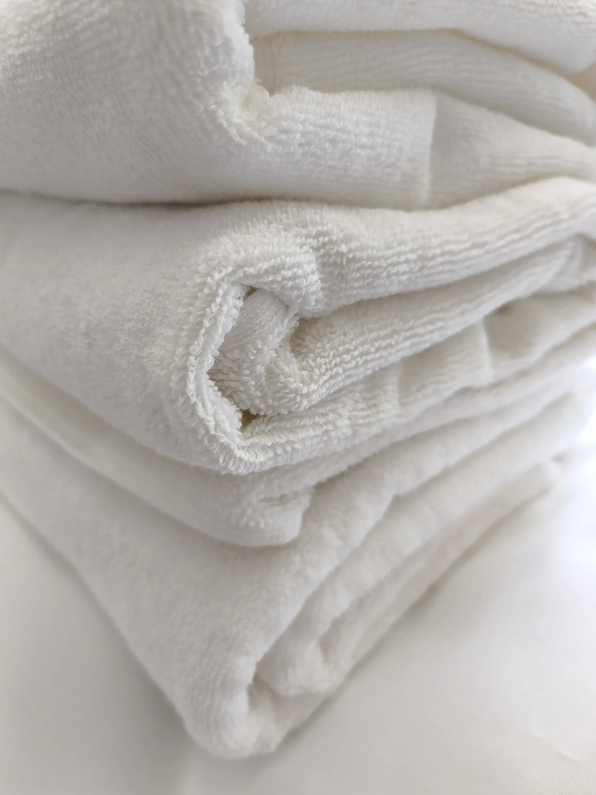 How Private Label Turkish Towel Manufacturing Works Private label Turkish towels stacked for bulk production